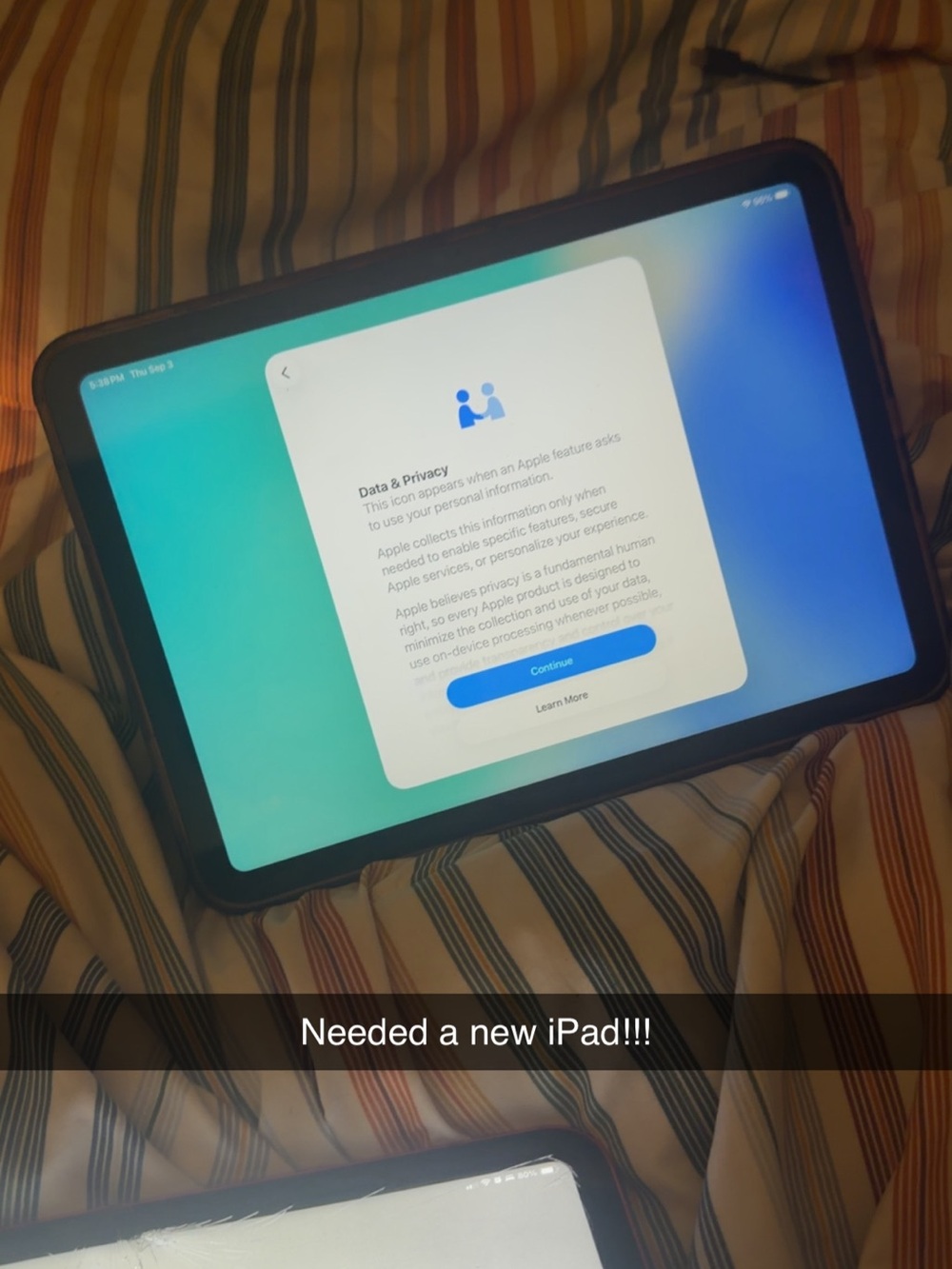 Apple iPad in Black with Blue-Green Wallpaper
